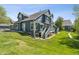 Charming rear exterior showing a multi-level deck and access to a well-maintained lawn, perfect for outdoor enjoyment at 4976 S Nelson St # A, Littleton, CO 80127