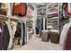 Organized walk-in closet with shelving, rods, and ample storage space at 4976 S Nelson St # A, Littleton, CO 80127