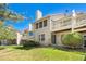 The backyard features a lush lawn, mature trees, and an outdoor patio, perfect for relaxation at 8270 S High Ct, Centennial, CO 80122