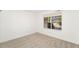 Bright bedroom with a large window offering natural light and scenic views at 8270 S High Ct, Centennial, CO 80122