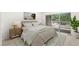 Relaxing bedroom with a large bed, neutral decor, and sliding glass doors to a private balcony at 8270 S High Ct, Centennial, CO 80122