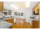 Bright kitchen featuring modern appliances, granite countertops, and ample cabinet space at 8270 S High Ct, Centennial, CO 80122