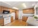 Functional kitchen with ample counter space, modern appliances, and abundant cabinet storage at 8270 S High Ct, Centennial, CO 80122