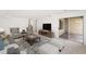 Cozy living room with plush seating, a large TV, and a sliding glass door leading to the outside at 8270 S High Ct, Centennial, CO 80122