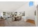Inviting open concept living space featuring a fireplace, dining area, and lots of natural light at 8270 S High Ct, Centennial, CO 80122