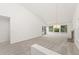 Light-filled living room with access to a private balcony and a cozy fireplace at 8270 S High Ct, Centennial, CO 80122