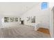 Bright living room with a fireplace and large windows, offering ample natural light at 8270 S High Ct, Centennial, CO 80122