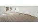 Bright room featuring wall to wall carpeting, two large windows and fresh paint at 8270 S High Ct, Centennial, CO 80122