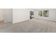 Bright room featuring wall to wall carpeting, a sliding glass door and fresh paint at 8270 S High Ct, Centennial, CO 80122
