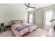 Spacious bedroom with a king-size bed and neutral color palette at 1152 Payton Ave, Fort Lupton, CO 80621