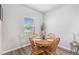 Small dining area with round wooden table and four chairs at 1152 Payton Ave, Fort Lupton, CO 80621