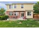 Backyard patio with seating, surrounded by well-maintained lawn and garden, ideal for relaxation and entertainment at 3109 S Jebel Way, Aurora, CO 80013