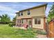 Backyard with patio, seating area, lawn, and privacy fence at 3109 S Jebel Way, Aurora, CO 80013