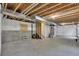 Spacious unfinished basement with concrete floor and exposed wood ceiling, offering potential for customization at 3109 S Jebel Way, Aurora, CO 80013