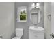Bathroom with white vanity and fixtures plus a window at 3109 S Jebel Way, Aurora, CO 80013