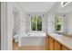 Bathroom featuring a soaking tub, vanity, and tiled flooring at 3109 S Jebel Way, Aurora, CO 80013