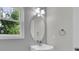 Bright bathroom with a window and a white vanity at 3109 S Jebel Way, Aurora, CO 80013