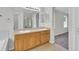 Bright bathroom with double sink vanity, large mirror, and separate shower and toilet area at 3109 S Jebel Way, Aurora, CO 80013