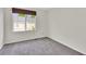 Carpeted bedroom with a window at 3109 S Jebel Way, Aurora, CO 80013