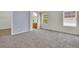 Bright bedroom featuring neutral carpet, light purple walls, and access to the en-suite bathroom at 3109 S Jebel Way, Aurora, CO 80013
