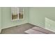 Cozy bedroom featuring neutral carpet and a window at 3109 S Jebel Way, Aurora, CO 80013