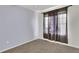 Comfortable bedroom showcasing neutral carpet and curtains at 3109 S Jebel Way, Aurora, CO 80013