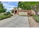 Charming two-story home featuring a brick facade, a cozy front porch, and a spacious two-car garage at 3109 S Jebel Way, Aurora, CO 80013