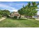 Charming two-story home with a well-manicured lawn and mature trees creating a welcoming curb appeal at 3109 S Jebel Way, Aurora, CO 80013