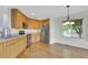 Well-equipped kitchen featuring wooden cabinets and stainless-steel appliances at 3109 S Jebel Way, Aurora, CO 80013