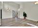 Bright living room featuring tall ceilings, hardwood floors, chandelier, and an open layout at 3109 S Jebel Way, Aurora, CO 80013