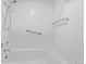 Clean bathroom with shower/tub combo and grab bar at 1777 Larimer St # 2209, Denver, CO 80202