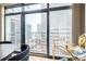 Modern dining area with stunning city views from large windows at 1777 Larimer St # 2209, Denver, CO 80202