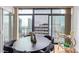 Modern dining area with stunning city views and a bar cart at 1777 Larimer St # 2209, Denver, CO 80202