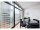 Modern dining area with large windows and city views at 1777 Larimer St # 2209, Denver, CO 80202