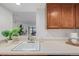 Modern kitchen, stainless steel appliances, wood cabinets at 1777 Larimer St # 2209, Denver, CO 80202