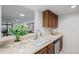 Modern kitchen with stainless steel appliances and wood cabinets at 1777 Larimer St # 2209, Denver, CO 80202