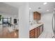 Open kitchen with stainless steel appliances, view of living room at 1777 Larimer St # 2209, Denver, CO 80202