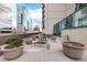 Relaxing rooftop patio with seating and planters, offering city views at 1777 Larimer St # 2209, Denver, CO 80202