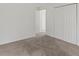 Well-lit bedroom featuring neutral carpet, large closets and two entryways at 1643 S Fairplay St, Aurora, CO 80012