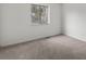 Bedroom with neutral carpeting and one window providing natural light at 1643 S Fairplay St, Aurora, CO 80012