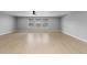 Open basement with hardwood floors, natural light, and recessed lighting at 1815 Avery Way, Castle Rock, CO 80109