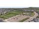 Aerial view of community park with a large sports field, playground and tennis courts at 1815 Avery Way, Castle Rock, CO 80109