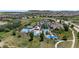 Aerial view of a community pool, clubhouse and recreational facilities in a quiet suburban neighborhood at 1815 Avery Way, Castle Rock, CO 80109