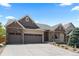 Inviting two-story home with a three-car garage and well-maintained landscaping, exuding curb appeal at 1815 Avery Way, Castle Rock, CO 80109