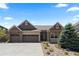 Charming single-Gathering home with a three car garage, rock landscaping and covered front porch at 1815 Avery Way, Castle Rock, CO 80109