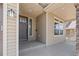 Charming front porch with stone column and ample natural light at 1815 Avery Way, Castle Rock, CO 80109