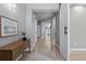 Well-lit hallway with modern decor and wood laminate flooring and adjacent doorways at 1815 Avery Way, Castle Rock, CO 80109
