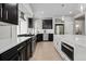 Modern kitchen featuring stainless steel appliances, white countertops, dark cabinets, and center island at 1815 Avery Way, Castle Rock, CO 80109
