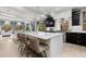 Bright, open kitchen with a large island, modern appliances, and stylish pendant lighting at 1815 Avery Way, Castle Rock, CO 80109
