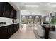 Open-concept living space with high ceilings, abundant natural light, and stylish furnishings at 1815 Avery Way, Castle Rock, CO 80109
